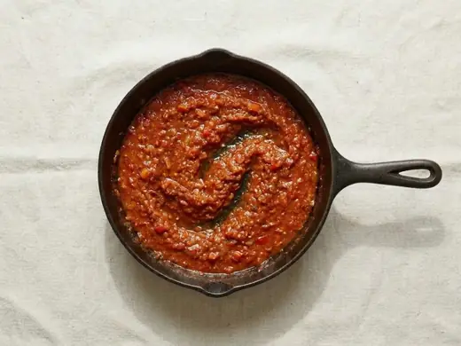 Tomato sauce simmering in the skillet